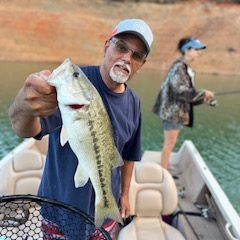 My husband with a bass at Shasta Lake